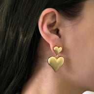 Lady wearing Aria Double Heart Drop Earrings by Deduet