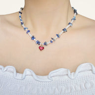 Lady wearing rita pearl heart necklace by deduet