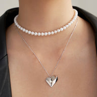 Lady wearing Zoe pendant necklace silver