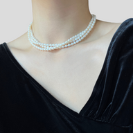 Lady wearing Elena Three-Strand Pearl Necklace by Deduet