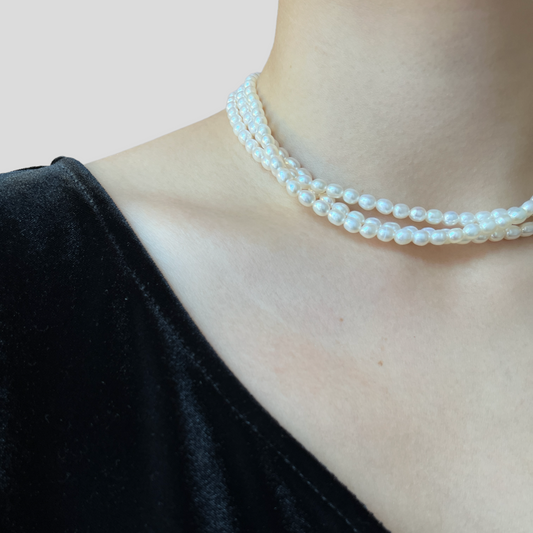 Lady wearing Elena Three-Strand Pearl Necklace by Deduet