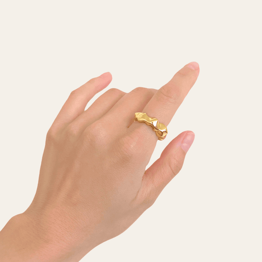 Lady wearing Sloane Adjustable Wavy Ring in Gold by Deduet
